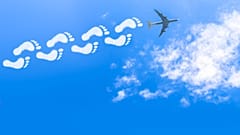 Flying could soon be limited by personal carbon allowances, report warns.