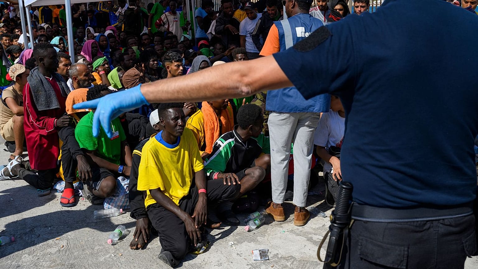 Migrants wait to be transferred from Lampedusa Island, Italy, Friday, Sept. 15, 2023.