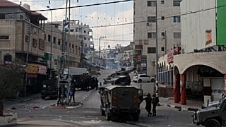 آثار الاشتباكات في حوارة