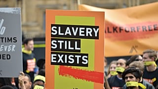 People march against modern slavery through London in 2017
