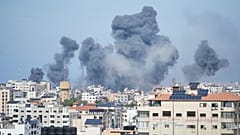 Smoke rises from an explosion caused by an Israeli airstrike in the Gaza Strip