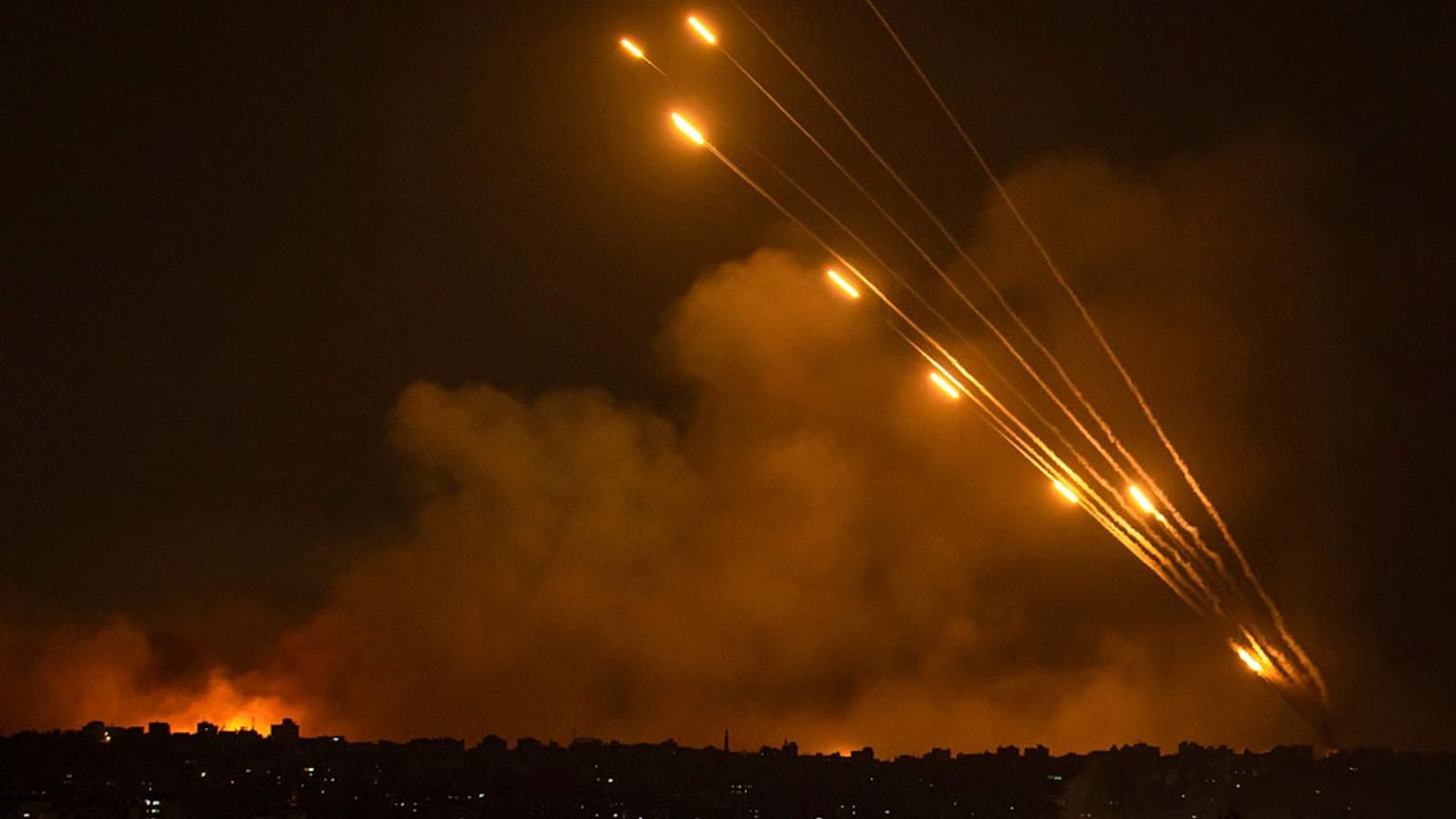 Rockets are fired toward Israel from the Gaza Strip, Sunday, Oct. 8, 2023