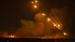 Rockets are fired toward Israel from the Gaza Strip, Sunday, Oct. 8, 2023
