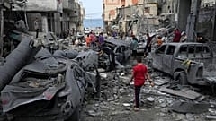 Palestinians inspect the rubble of the West mosque destroyed after it was hit by an Israeli airstrike at Shati refugee camp in Gaza City, early Monday, Oct. 9, 2023.