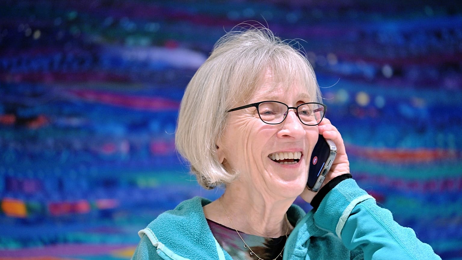 Claudia Goldin speaks to a reporter on the phone in her home in Cambridge, Mass. after learning that she received the Nobel Prize in Economics. 