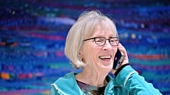 Claudia Goldin speaks to a reporter on the phone in her home in Cambridge, Mass. after learning that she received the Nobel Prize in Economics. 