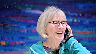 Claudia Goldin speaks to a reporter on the phone in her home in Cambridge, Mass. after learning that she received the Nobel Prize in Economics.