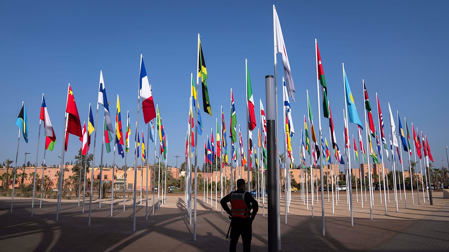 A member of the security forces stands guard outside a convention center hosting the IMF and World Bank annual meetings, in Marrakech, Morocco, Sunday, Oct. 8, 2023.