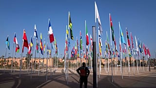 A member of the security forces stands guard outside a convention center hosting the IMF and World Bank annual meetings, in Marrakech, Morocco, Sunday, Oct. 8, 2023.