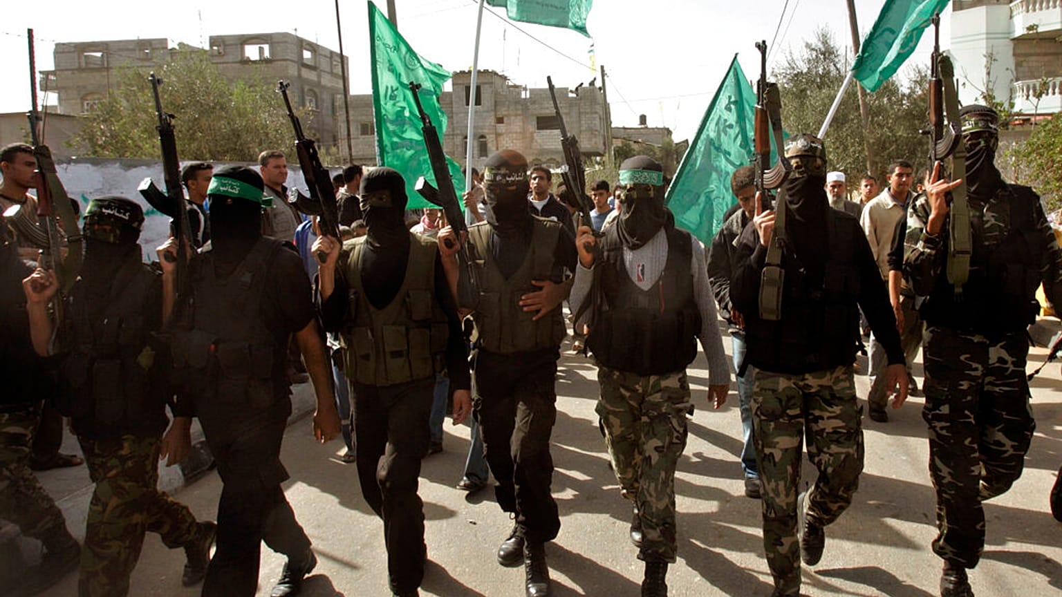 Masked Palestinian Hamas militant attend the funeral of Hamas militant Mahmmed Al Najar in the town of Khan Younis, southern Gaza Strip, Tuesday, Nov. 20, 2007.