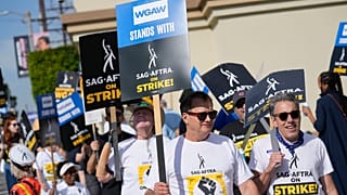 While writers have signed their new deal with studios, union leaders say they'll continue to picket with striking actors.