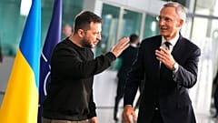 Ukraine's President Volodymyr Zelenskyy and NATO Secretary-General Jens Stoltenberg arrive at NATO headquarters in Brussels on October 11, 2023. 