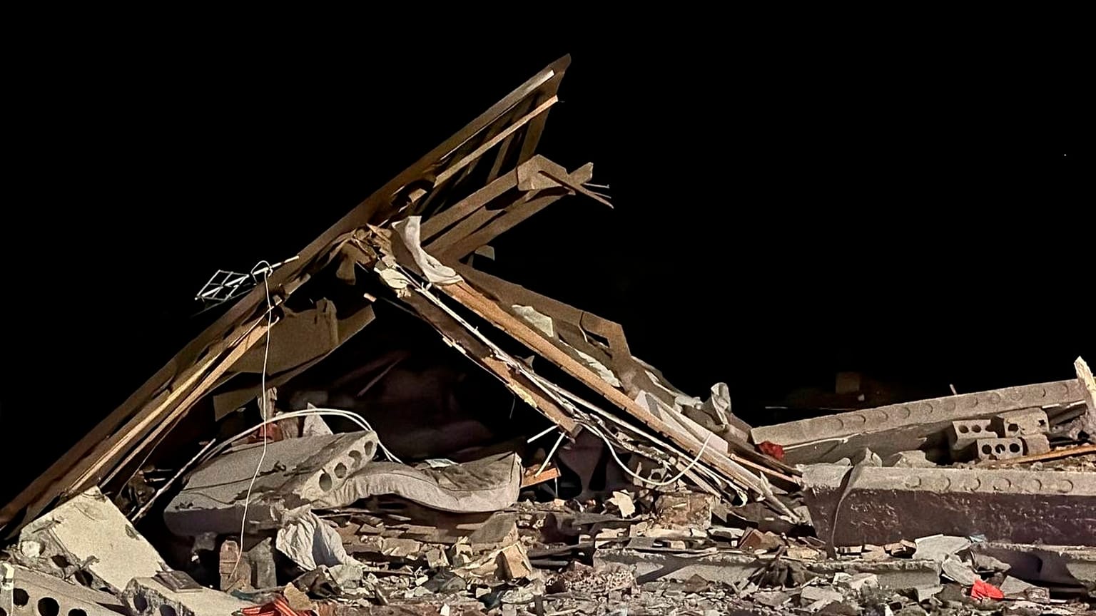 Oct. 12, 2023, shows a damaged house destroyed by debris of a Ukrainian drone that was shot down by Russian air defense outside Belgorod, Russia. 