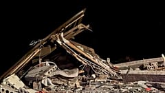 Oct. 12, 2023, shows a damaged house destroyed by debris of a Ukrainian drone that was shot down by Russian air defense outside Belgorod, Russia. 