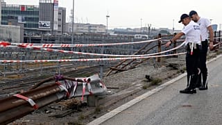 Local Police officers check the scene of a passenger bus accident in Mestre, near the city of Venice, Italy, Wednesday, Oct. 4, 2023. 