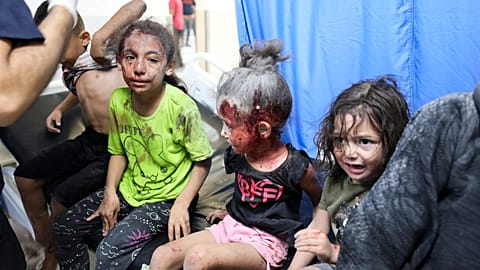 Palestinian children wounded in Israel strikes are brought to Shifa Hospital in Gaza City on Wednesday, Oct. 11, 2023.