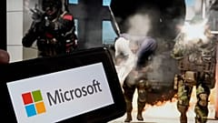 Das Logo von Microsoft und eine Szene aus "Call of Duty - Modern Warfare" von Activision sind auf diesem Foto in New York am 21\. Juni 2023 zu sehen.