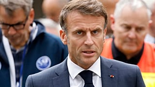 French President Emmanuel Macron talks to the press at the Gambetta high school in Arras.