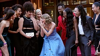 Taylor Swift, centre, and tour dancers arrive at the world premiere of the concert film Taylor Swift: The Eras Tour