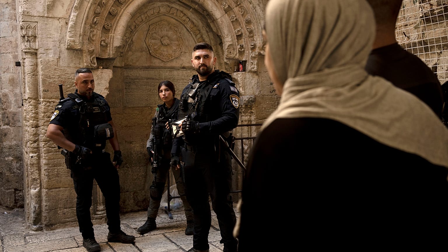 Israeli police wait to check Palestinian worshippers’ ID ahead of Friday prayers at the Al-Aqsa Mosque compound in the Old City of Jerusalem, Friday, Oct. 13, 2023