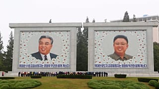 FILE - Citizens visit the portraits of the country's late leaders Kim Il Sung and Kim Jong Il on the occasion of the 78th founding anniversary of the Worker's Party of Korea