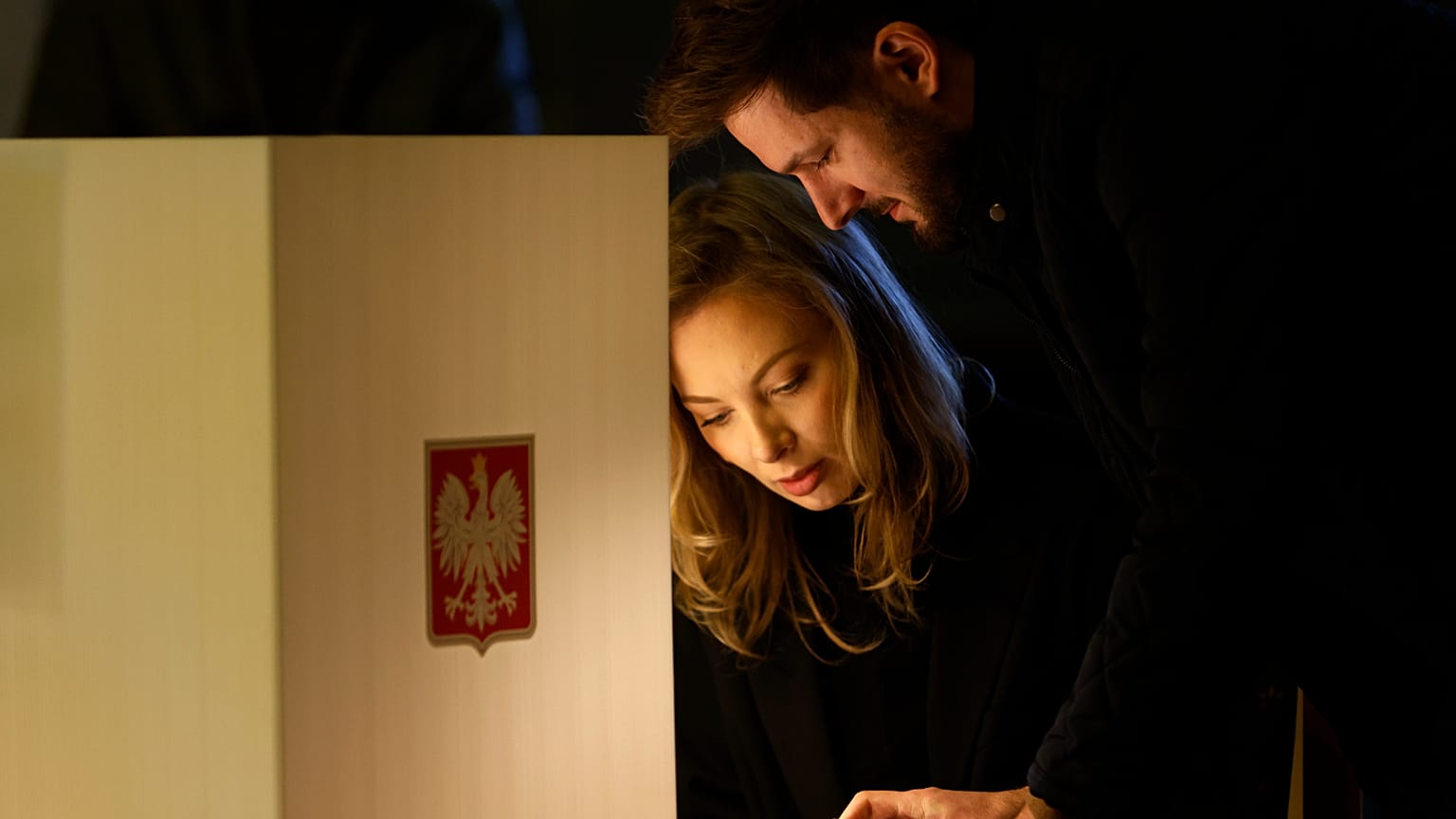 Residents attend parliamentary elections in Warsaw, Poland, Sunday