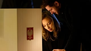 Residents attend parliamentary elections in Warsaw, Poland, Sunday