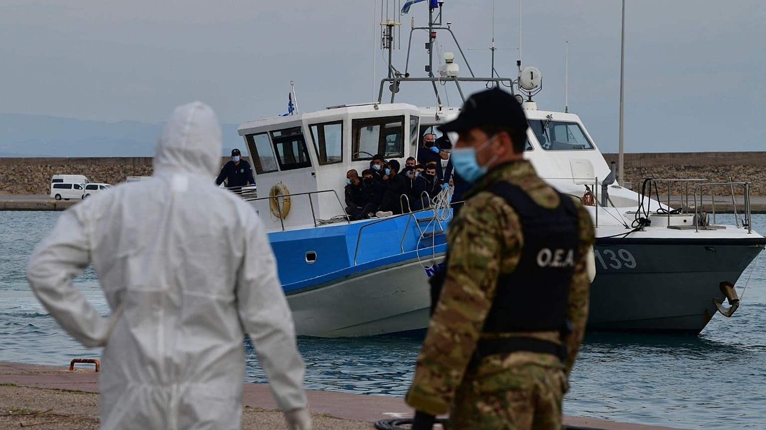 A vessel with migrants arrive after an operation by the Greek Coast guard at the port of Katakolo, western Greece, Tuesday, Nov. 3, 2020.