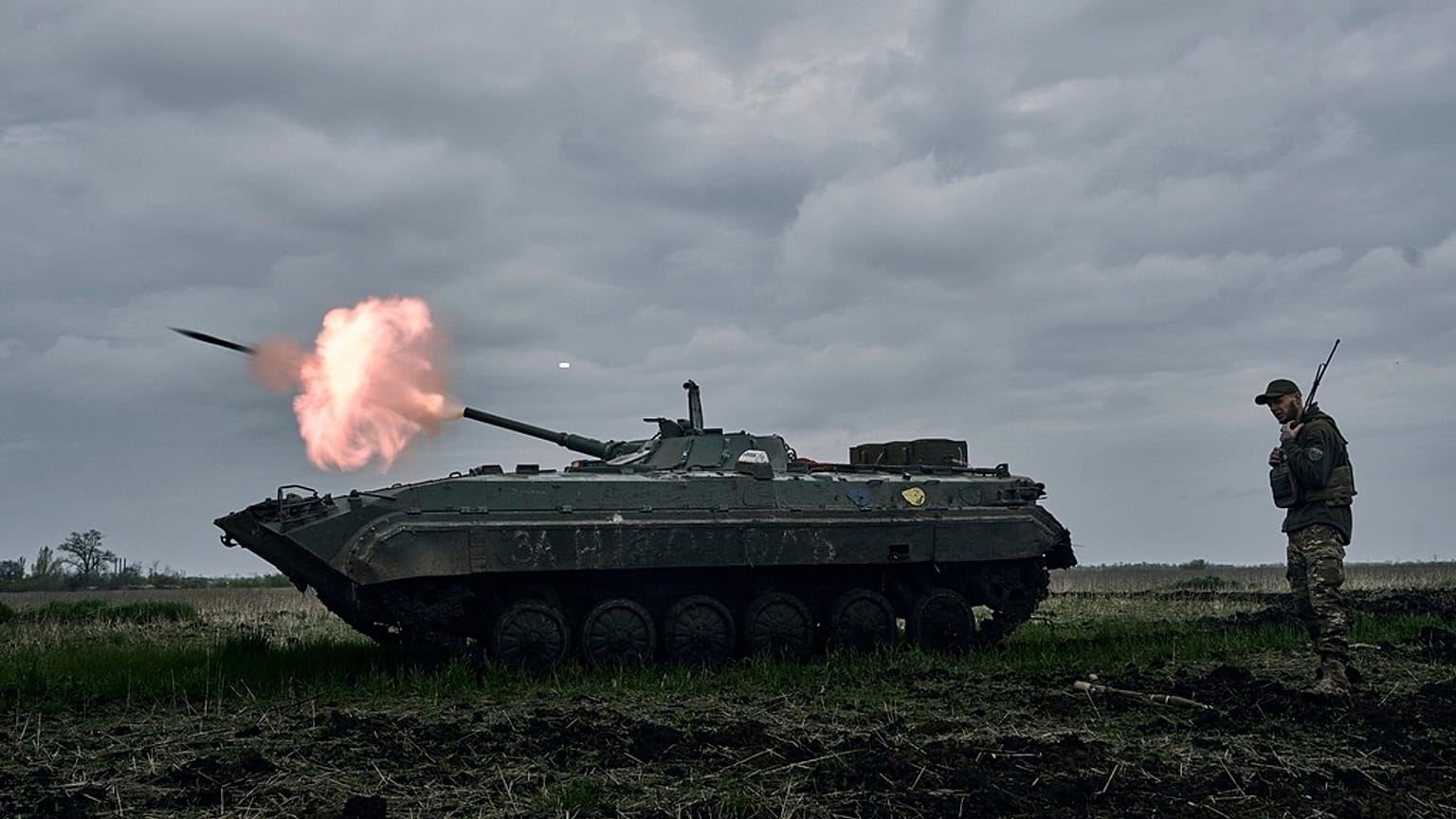 A Ukrainian APC fires towards Russian positions near Avdiivka, in the Donetsk region, Ukraine.