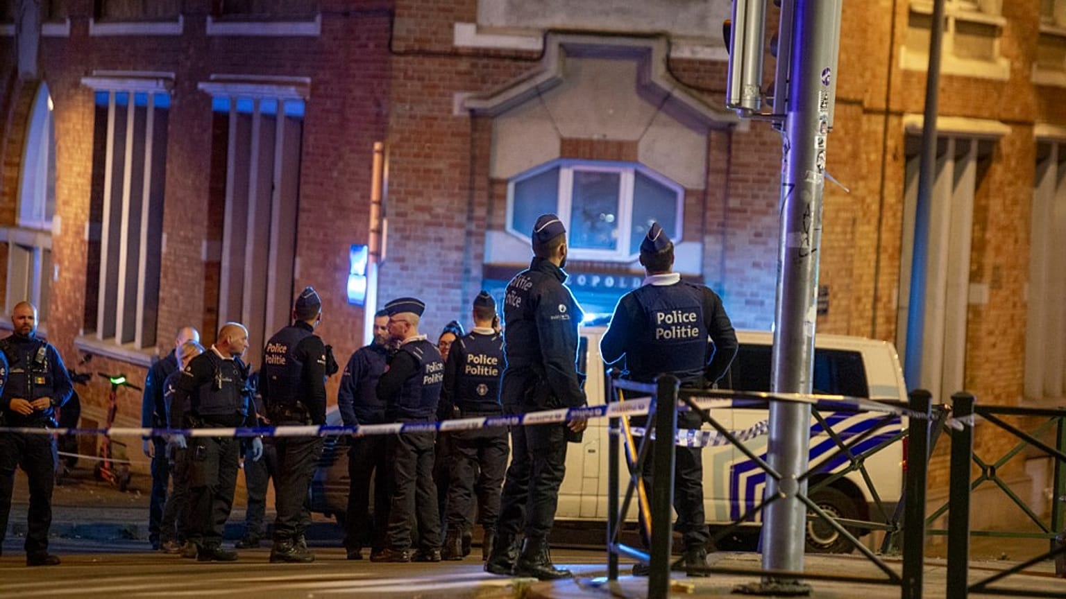 Belgium police stand at the site of a shooting incident in the Ieperlaan - Boulevard d'Ypres, in Brussels, on October 16, 2023.
