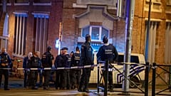 Belgium police stand at the site of a shooting incident in the Ieperlaan - Boulevard d'Ypres, in Brussels, on October 16, 2023.
