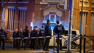 Belgium police stand at the site of a shooting incident in the Ieperlaan - Boulevard d'Ypres, in Brussels, on October 16, 2023.