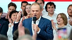 FILE - Donald Tusk, a former Polish prime minister addresses supporters at his party headquarters in Warsaw, Poland, Sunday, Oct. 15, 2023. 