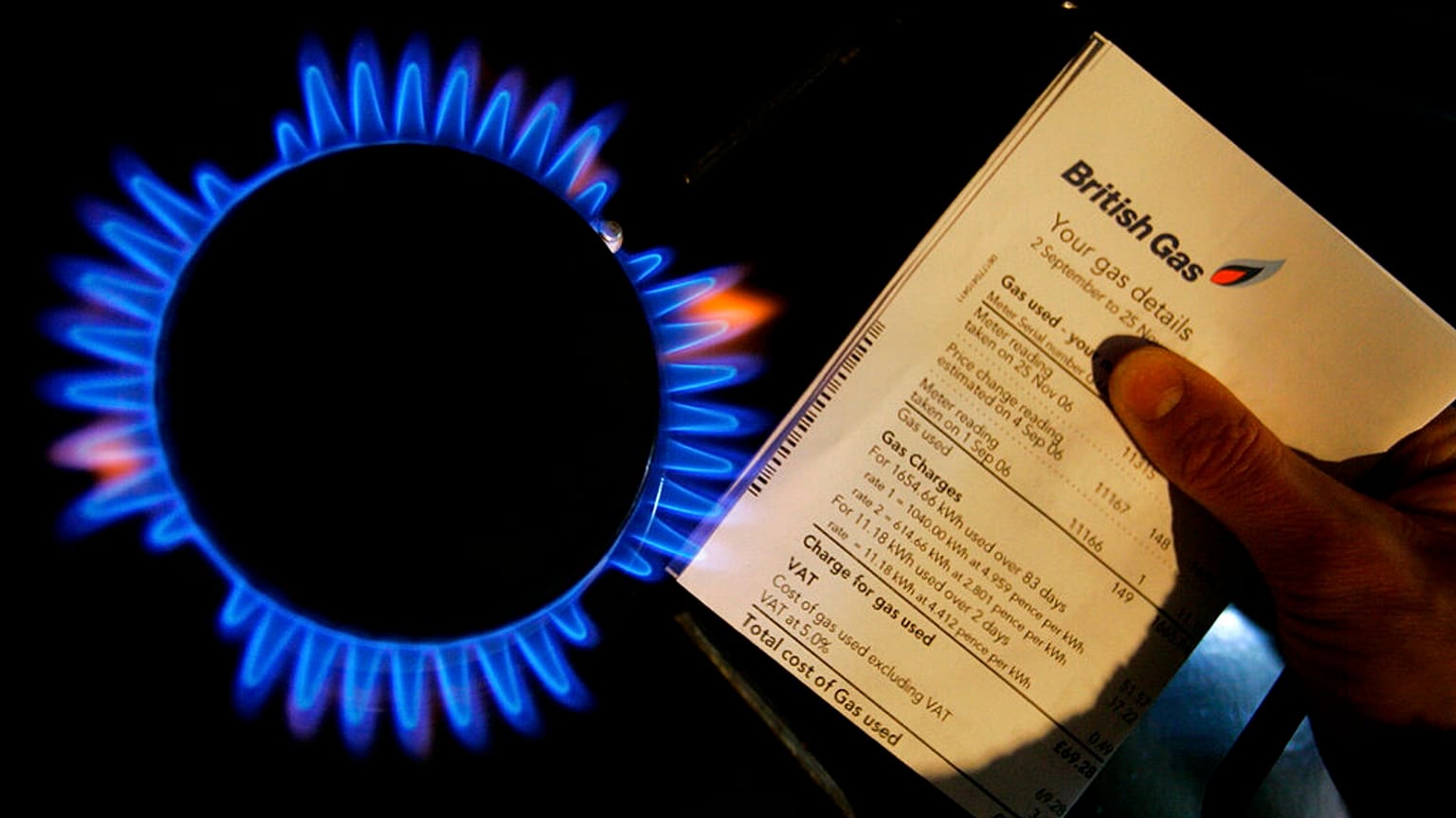 FILE - A British Gas bill is displayed by a gas ring on a cooker in this photo illustration in London, Thursday, Feb. 21, 2008. 