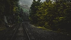 Railways have it all: abandoned stations; the screeching of rusty tracks; the shadowy corners of a vintage rail car. 