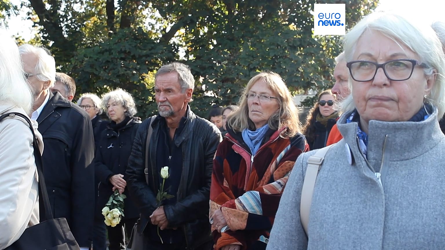 Crowds gather for a moment of silence 