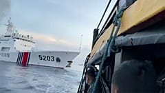 Filipino sailors look after a Chinese coast guard ship with bow number 5203 bumps their supply boat as they approach Second Thomas Shoal, Oct. 22, 2023.