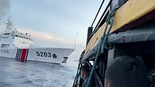 Filipino sailors look after a Chinese coast guard ship with bow number 5203 bumps their supply boat as they approach Second Thomas Shoal, Oct. 22, 2023.