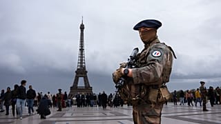 A French soldier guards the Trocadero area in front of the Eiffel Tower as France is on high alert for terrorism.