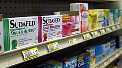 Sudafed and other common nasal decongestants containing pseudoephedrine are on display behind the counter at Hospital Discount Pharmacy in Edmond, Oklahoma in the US in 2005.