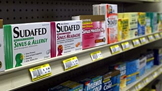 Sudafed and other common nasal decongestants containing pseudoephedrine are on display behind the counter at Hospital Discount Pharmacy in Edmond, Oklahoma in the US in 2005.