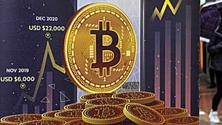 An advertisement for Bitcoin cryptocurrency is displayed on a street in Hong Kong, on Feb. 17, 2022.
