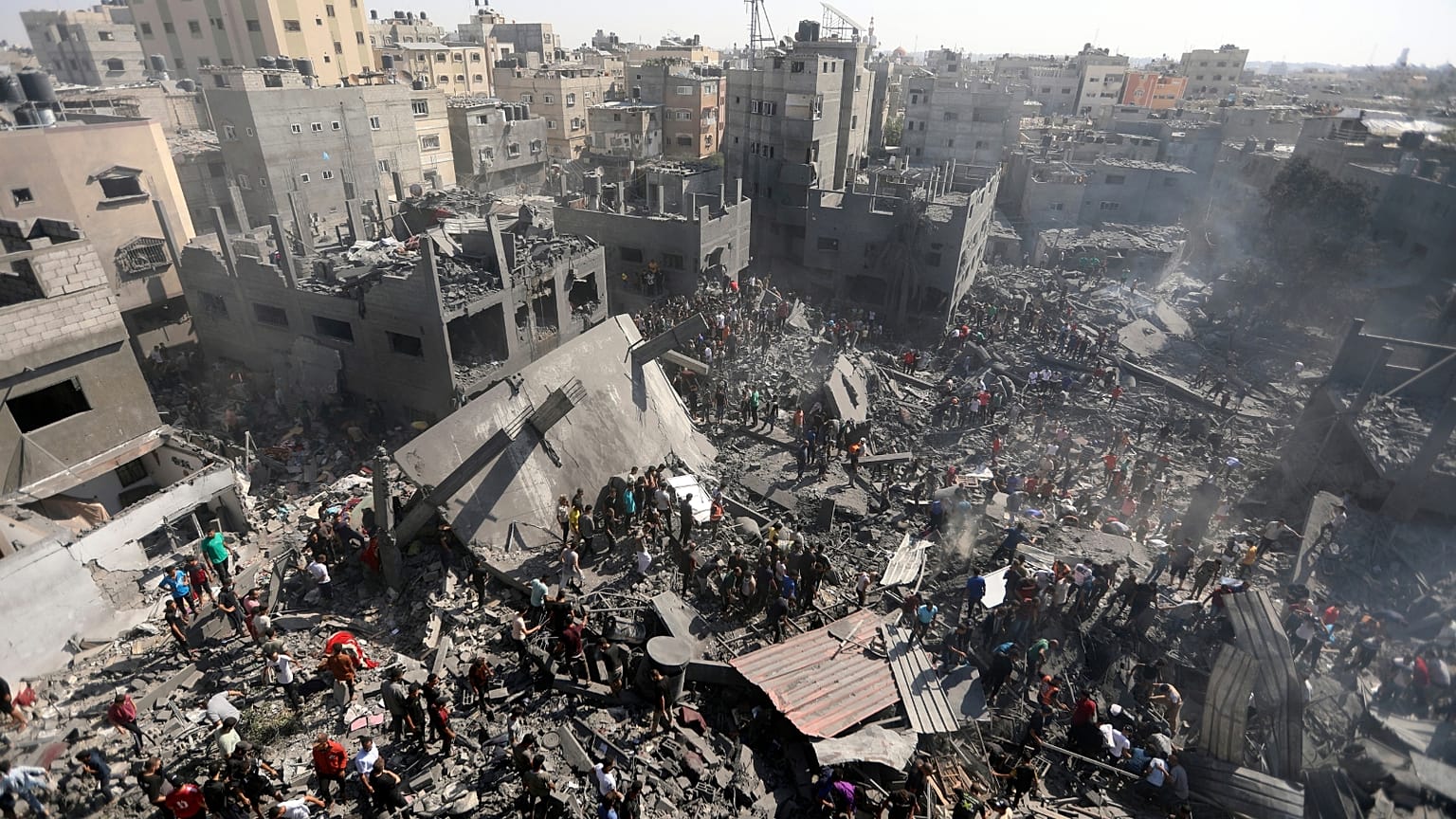Palestinians inspect the rubble of destroyed buildings following Israeli airstrikes on town of Khan Younis, southern Gaza Strip, Thursday, Oct. 26, 2023.