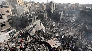 Palestinians inspect the rubble of destroyed buildings following Israeli airstrikes on town of Khan Younis, southern Gaza Strip, Thursday, Oct. 26, 2023.