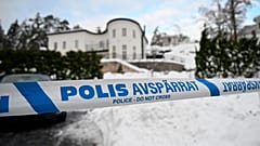 Police tape cordons an area outside a house where Swedish Security Service arrested two people on suspicions of espionage in a predawn operation in Stockholm, November 2022.