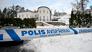 Police tape cordons an area outside a house where Swedish Security Service arrested two people on suspicions of espionage in a predawn operation in Stockholm, November 2022.