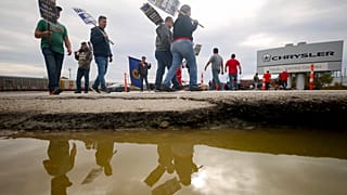 Brian "Rooster" Heppner, a United Auto Workers Local 12 member, pickets during the ongoing UAW strike at the Stellantis Toledo Assembly Complex on Wednesday, Oct. 25, 2023.