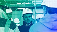 French President Emmanuel Macron wearing a worker's helmet in Paris, April 2023