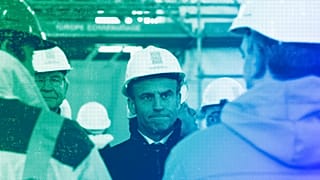 French President Emmanuel Macron wearing a worker's helmet in Paris, April 2023