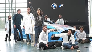 Activists take part in an a non-violent action at a BMW showroom in October last year.